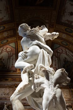 Rome, Italy - 28 December 2023: Galleria Borghese - Borghese Gallery - The rape of Proserpina, by Gian Lorenzo Bernini, 1622 - white Carrara marble statue