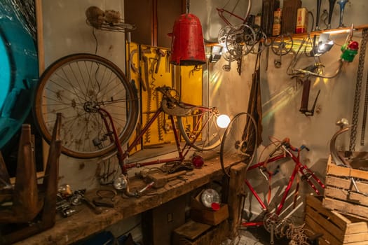 Old bicycle repair shop. Fixing mechanic issues in a garage, bike maintenance