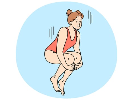 Woman swimmer jumps from springboard to dive underwater into pool or sea. Girl in swimsuit dives into pool while participating in ski jumping or synchronized swimming competitions.