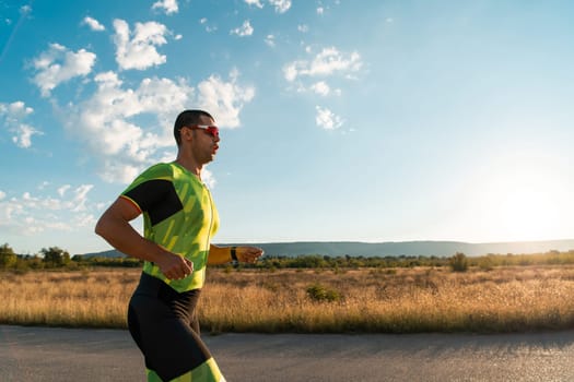 Triathlete in professional gear running early in the morning, preparing for a marathon, dedication to sport and readiness to take on the challenges of a marathon