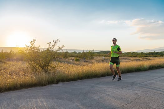 Triathlete in professional gear running early in the morning, preparing for a marathon, dedication to sport and readiness to take on the challenges of a marathon