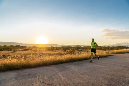 Triathlete in professional gear running early in the morning, preparing for a marathon, dedication to sport and readiness to take on the challenges of a marathon