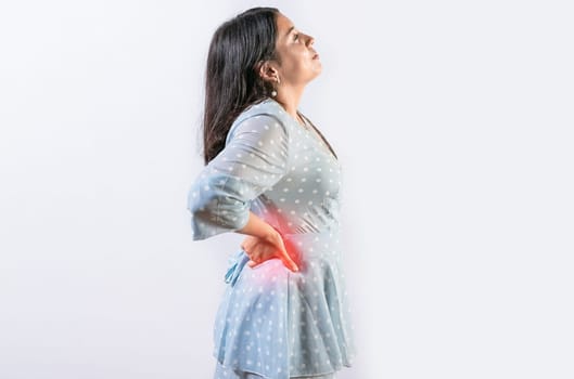 Suffering girl with back pain isolated. Young woman with spine problems isolated. Person with back pain. lumbar problems concept