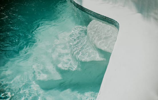 Details of stairs of a home swimming pool. Design and detail of stairs of a home pool