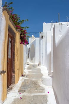 Narrow street in Emporeio - view of streets of medieval village Emporio at Santorini island, Greece
