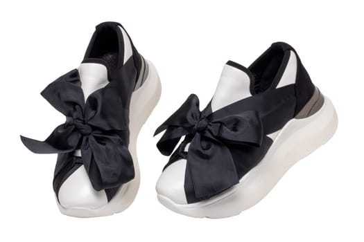 Closeup of a pair black white elegant stylish female leather high-heeled sport shoes isolated. Womens shoe fashion. Modern design footwear for workout.