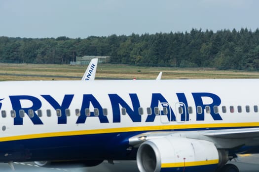 WEEZE, NRW, GERMANY - SEPTEMBER 10, 2018: Weeze, Nrw, Germany - September 10, 2018: Airplane of the airline Ryanair on the runway of Weeze airport.