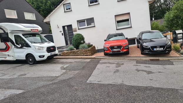 HEILIGENHAUS, NRW, GERMANY - JULY 31, 2021: Heiligenhaus, Nrw, Germany - July 31, 2021: Motorhomes and campers for sale or rent. Concept freedom, family holiday travel, vacation travel with camper.