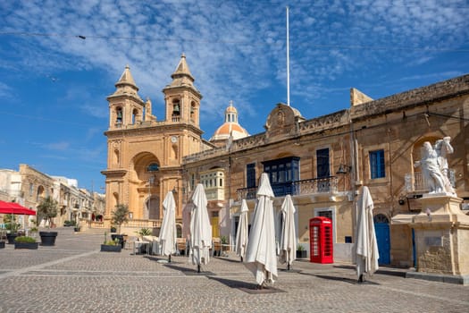 Beautiful Parish Church of Our Lady of Pompei, a prominent church with intricate architecture, overlooking the picturesque Marsaxlokk fishing village. Cultural heritage of Malta