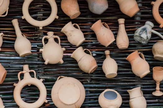 Ceramic clay terracotta jug, pot, vase, kitchen souvenirs in handmade ceramics street store.