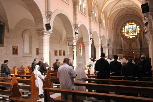 Pilgrims pray in the Church of Saint Catherine of Alexandria in Bethlehem, Israel