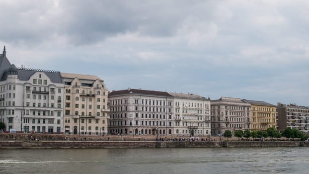 BUDAPEST-HUNGARY - 2023-05-06: General view of buildings lining the River Danube (on east, Pest side viewed from West Buda side) in Budapest, Hungary.