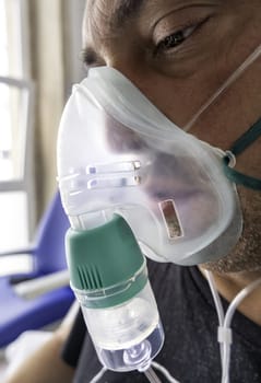 Detail of a sick person in a hospital with oxygen to breathe