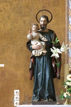 St. Joseph with the child Jesus, statue on the main altar in the parish church of St. Anne in Krizevci, Croatia