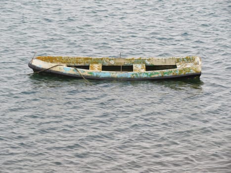 old sunken boat deteriorated abandoned wooden float