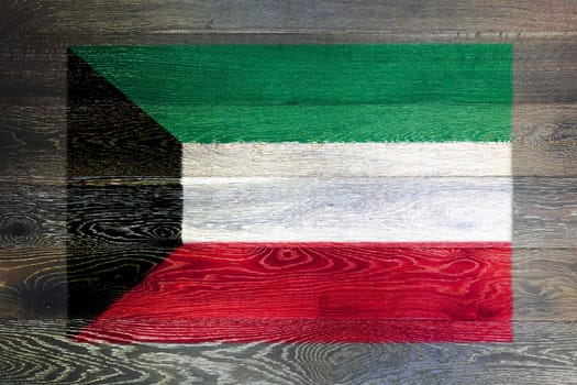 A Kuwait flag on rustic old wood surface background