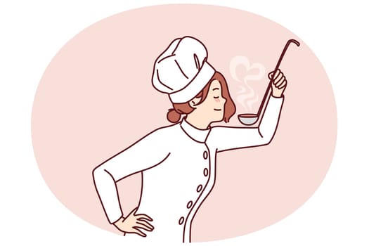 Woman cook with ladle in hand tries soup or sauce from menu preparing dish for restaurant guests. Girl in uniform and cook chef hat cooks food enjoying favorite job in cafe or diner