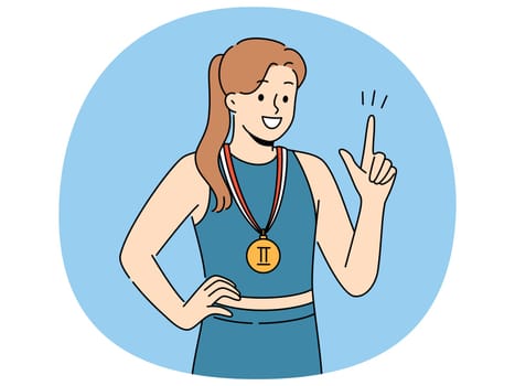 Woman athlete with sports medal for second place in running or gymnastics competition points up and smile. Champion girl recommends purchasing quality sportswear to achieve success in sports career