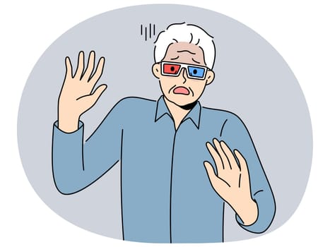 Elderly man in cinema glasses gets scared sees 3d special effects in movie for first time. Grey-haired pensioner in glasses exclaims and waves hands watching modern film with 3d effect