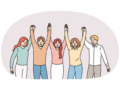 Friendly team holding hands and smiling for concept of successful collaboration to achieve ambitious goals. Team of students or colleagues from men and women rejoice at completion of joint project