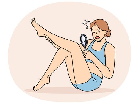 Woman is shocked by hair on legs and needs depilation or epilation in spa salon. Girl holding magnifying glass examining hair on legs for advertisement epilation services or body dysmorphic concept