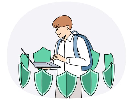 Boy with laptop is learning cyber protect and installing antivirus software standing among green shields. School student uses apps to cyber protect personal data from hackers or viruses