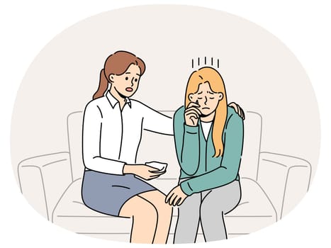 Crying woman at reception of psychologist consoling patient sitting on couch and experiencing stress. Girl sobs in psychologist office after being fired or having problems in personal life