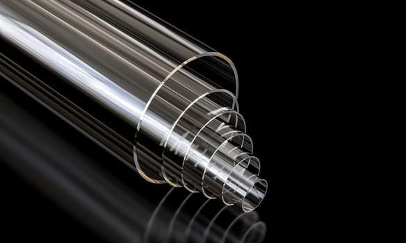 plexiglass plastic pipes stacked  reflecting  dark background