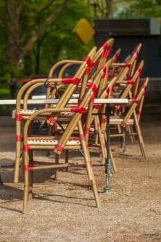 Stacked chairs in front of a restaurant, outdoor catering, Germany