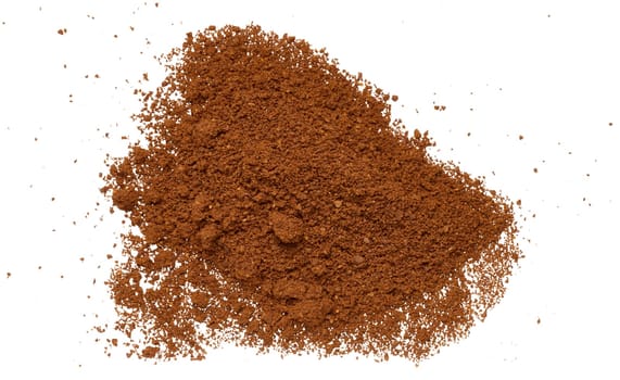 Scattered ground coffee beans on isolated background, top view