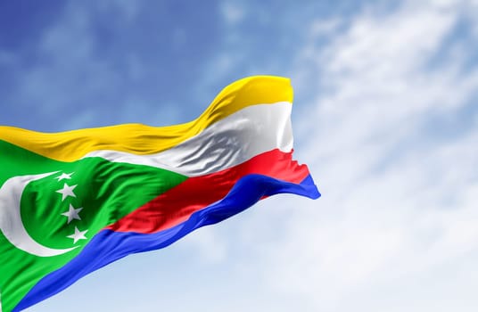 National flag of the Comoros waving in the wind on a clear day. Sovereign archipelago nation in the Indian Ocean. 3d illustration render. Rippling fabric