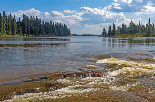 A Broad River Starting to Go Over Some Falls at Pisew Falls Provincial Park in Manitoba