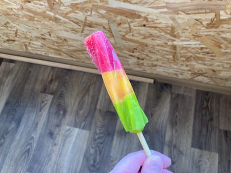Multicolored sweet ice cream on a the  stick