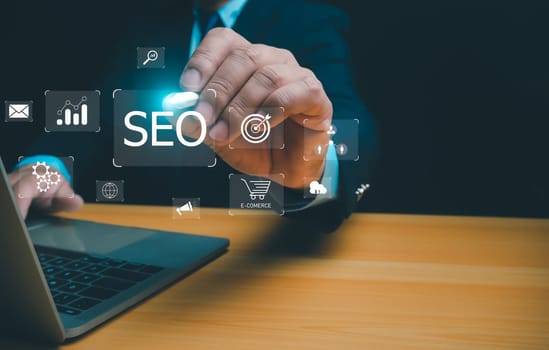 Businessman using a computer for analysis, SEO Search Engine Marketing, SEO Search engine optimization, Marketing ranking traffic website internet, Business technology, marketing concept.