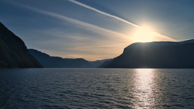 Sunset in Norwegian fjord landscape. View of fjord with mountains. Scandinavian nature from the north