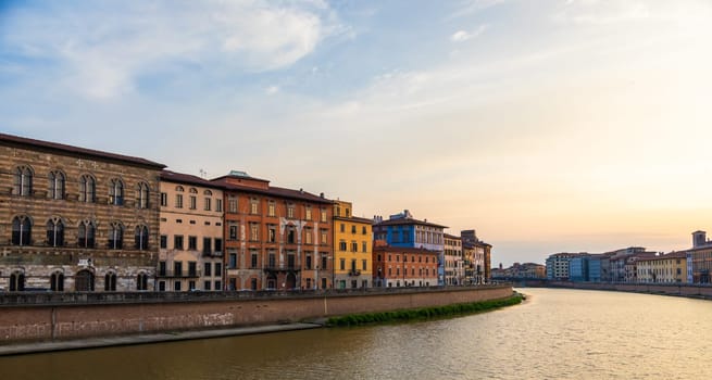 Pisa, Italy - 30 April 2024. The view of Arno river at sunset. Skyline cityscape.