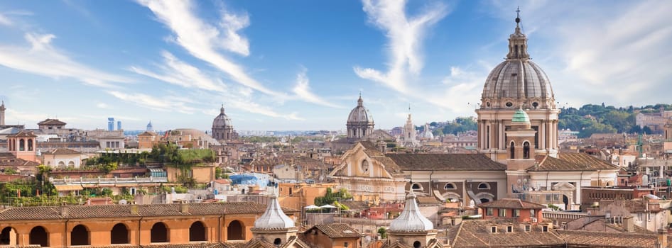 Rome, Italy. Urban landscape, blue sky with clouds, church exterior architecture.