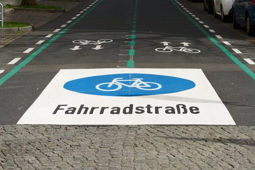 Bicycle lane, Fahrradstraße in the city center of Berlin-Mitte. Cyclists have priority over motorists on cycle lanes.