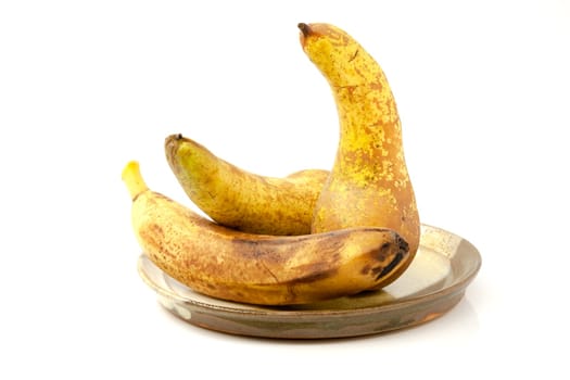 Pears and banana on a ceramic plate
