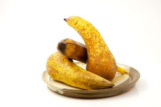 Pears and banana on a ceramic plate
