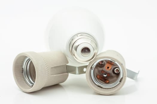 Electric ceramic socket model E27, for lighting. Selective focus with shallow depth of field.