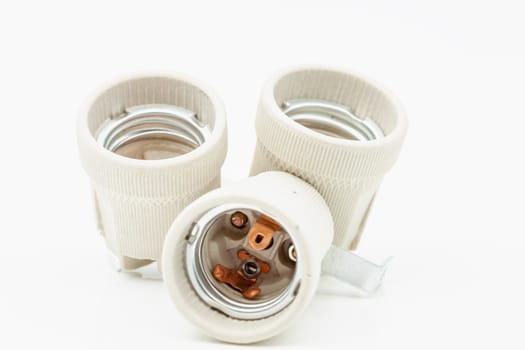 Electric ceramic socket model E27, for lighting. Selective focus with shallow depth of field.