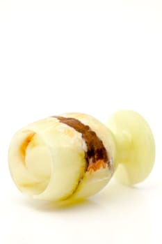 A glass of semi-precious stone onyx with healing and protective forces, according to beliefs. Selective focus with shallow depth of field.