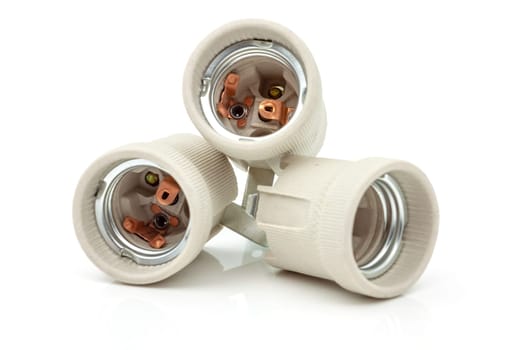 Electric ceramic socket model E27, for lighting. Selective focus with shallow depth of field.