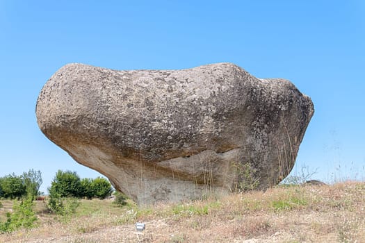 Benkovski, Bulgaria - July 9,2021- Rock mushroom, part of a large prehistoric sanctuary complex of the Thracian tribes inhabiting the region during the Iron Age.