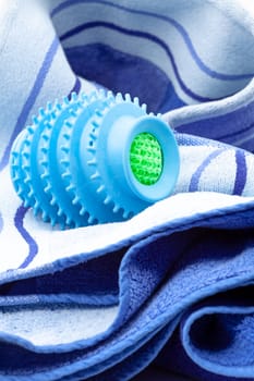 Silicone ball dryer removes moss from clothes and prevents creasing of clothes when drying. Selective focus with shallow depth of field.