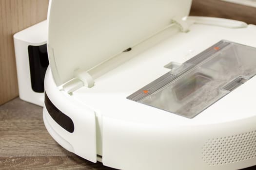 Modern digital home robot vacuum cleaner. Selective focus with shallow depth of field.