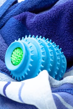 Silicone ball dryer removes moss from clothes and prevents creasing of clothes when drying. Selective focus with shallow depth of field.