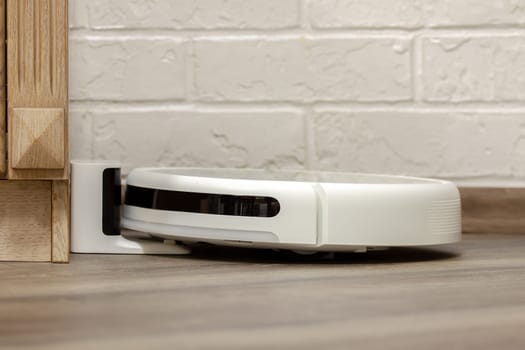 Modern digital home robot vacuum cleaner. Selective focus with shallow depth of field.