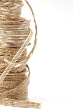 Rolls of braided cord of sackcloth and hemp for decoration and decoration. Selective focus with shallow depth of field.
